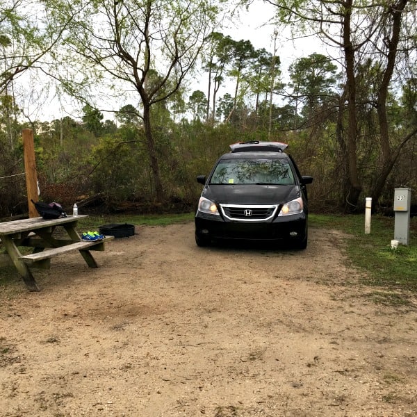 Minivan parked in a campsite