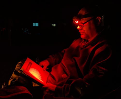 A headlamp is a cheap and easy lighting solution for minivan camping. 