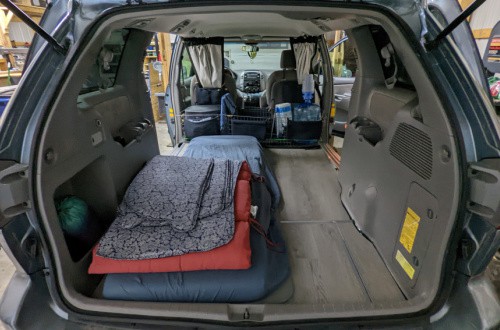 Toyota Sienna minivan with seats removed and level floor installed for minivan camping