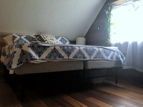 A king-size bed in the first Airbnb we booked.