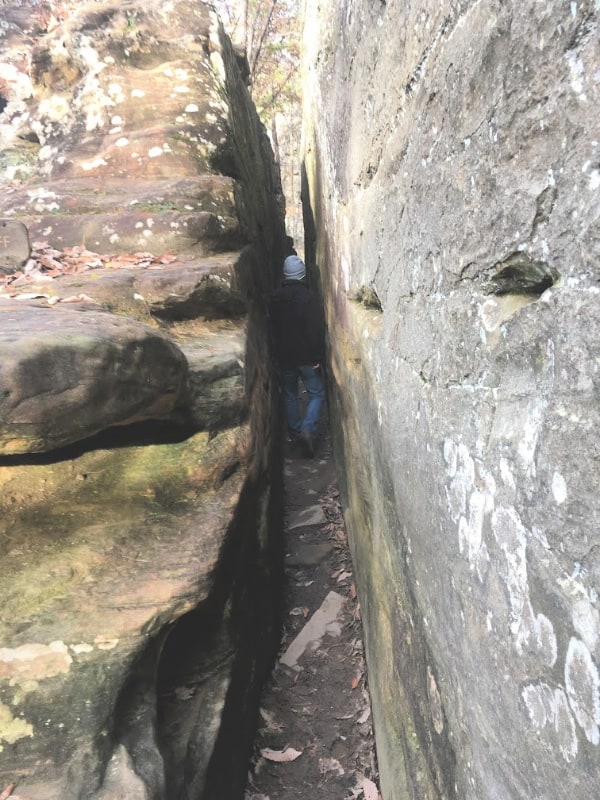 Tight squeeze between the Rocks at the bottom of Natural Bridge, KY.