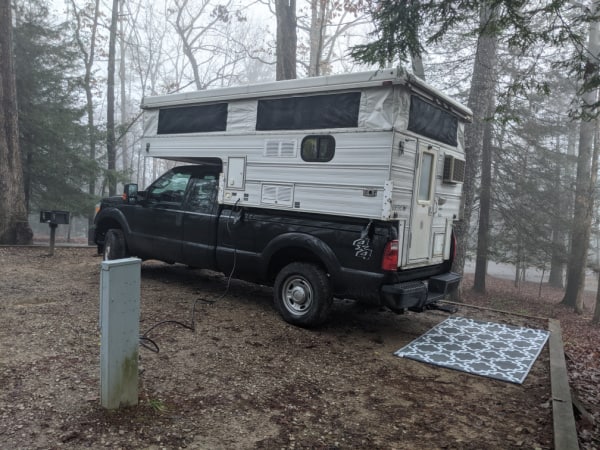 Our truck camper parked in a campsite within Fall Creek Falls State Park, Tennessee. 
