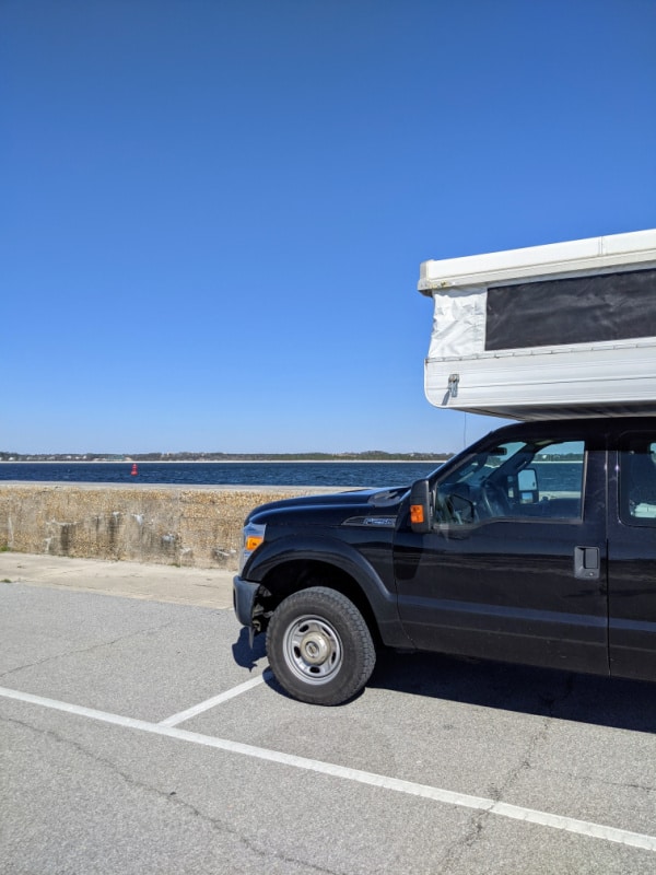 Soaking up views of the Pensacola Harbor from our truck camper. 