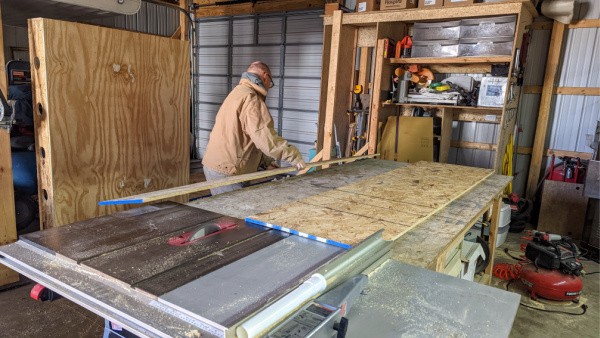 Making the cuts for what will become the storage drawer of the DIY truck topper camper build. 