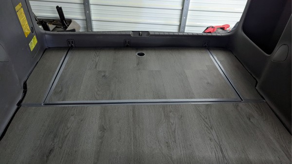 Finishing off the sides of the level minivan floor in the trunk area. 