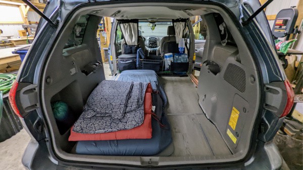 Simpl no-build minivan camper in a minivan with a DIY level floor conversion. 