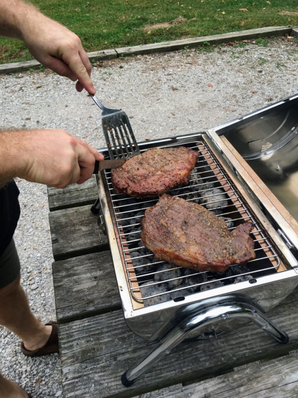 Cooking meat on the grill while out RVing