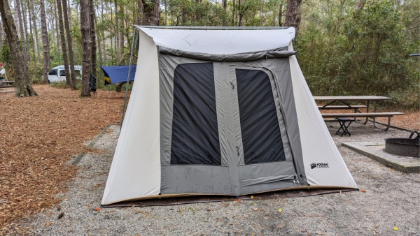 Kodiak canvas tent with awning rolled up. 
