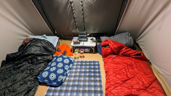 Sleeping room in a 10 ft by 10 ft Kodiak tent. 
