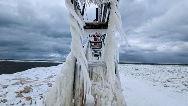 The long frozen icicles along the catwalk of the St Joseph, Michigan north pier. 